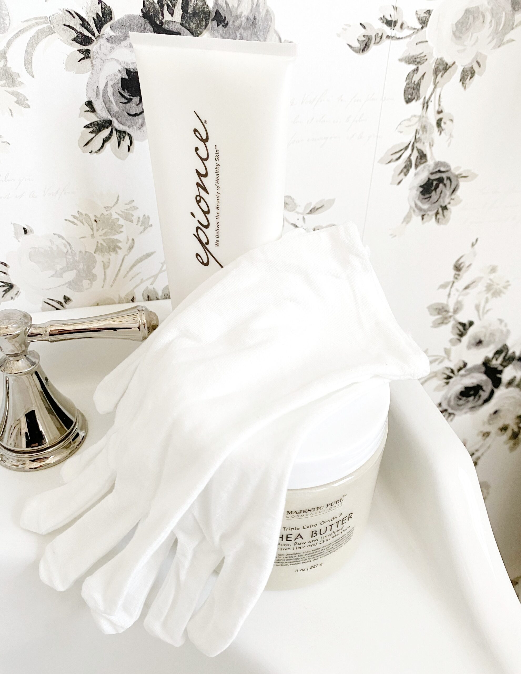 Dry winter hands remedy with cotton gloves, medical barrier cream, aloe gel, hydrosol, and shea butter