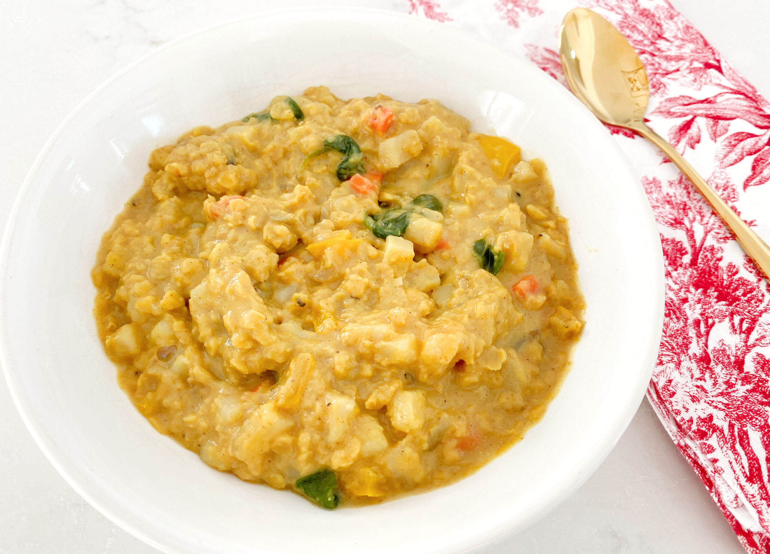 Red Lentil Curry Soup with Potatoes, Carrots, and Spinach